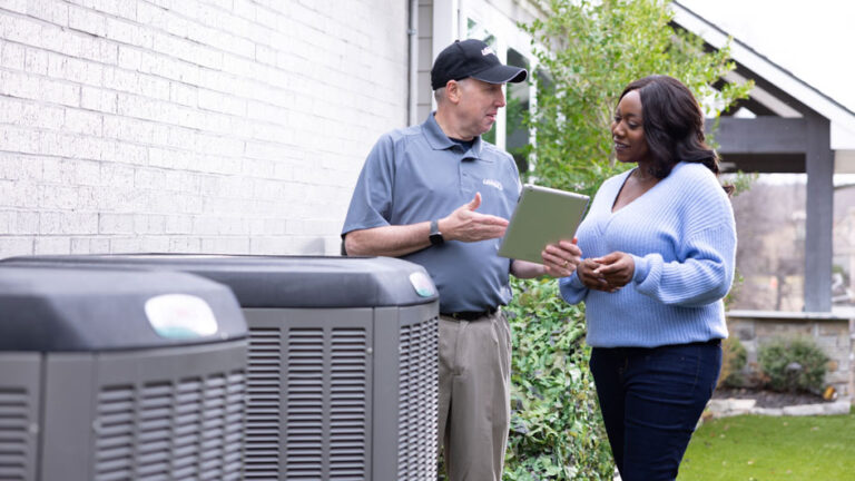 Woman and HVAC Professional having a conversation